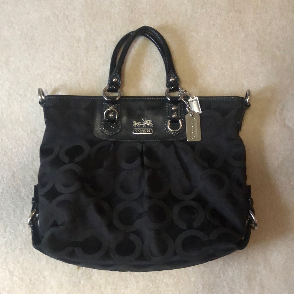 Black on black print Coach tote.